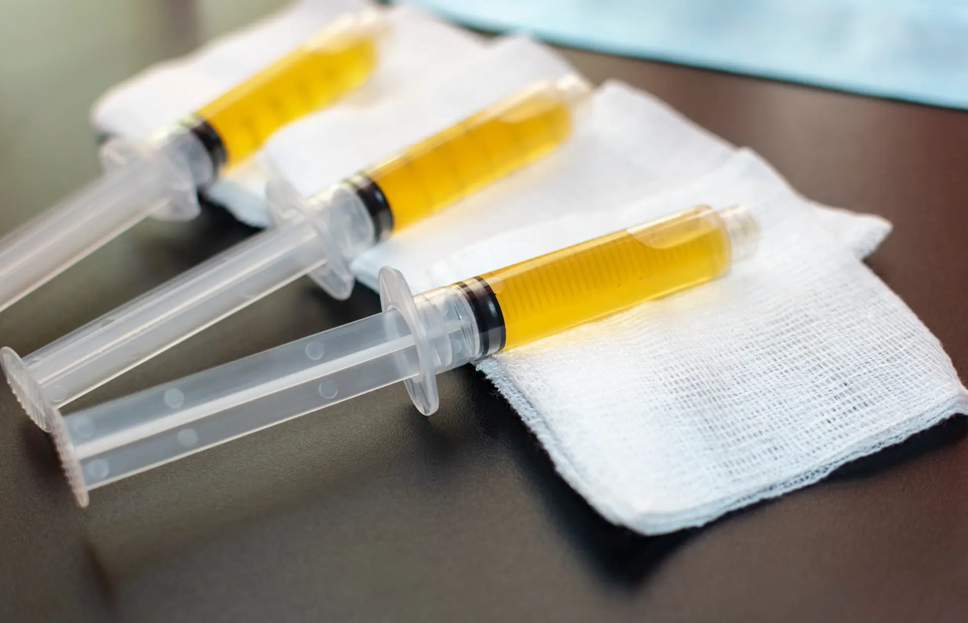 blood plasma as a hope for treatment of coronavirus infection. syringes with platelet rich plasma preparation for plasmolifting therapy. selective focus.